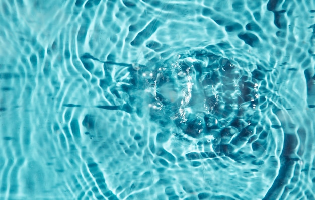 Water drops on a blue background a background for demonstrating cosmetics