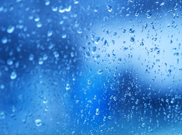 Water drops on car window bokeh background