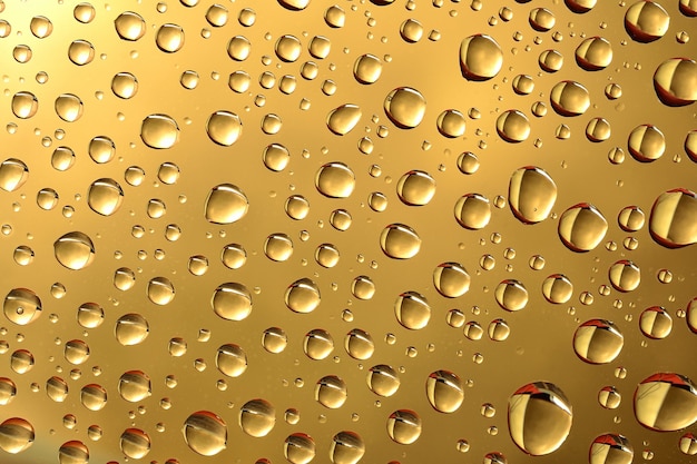 Water drops on golden surface