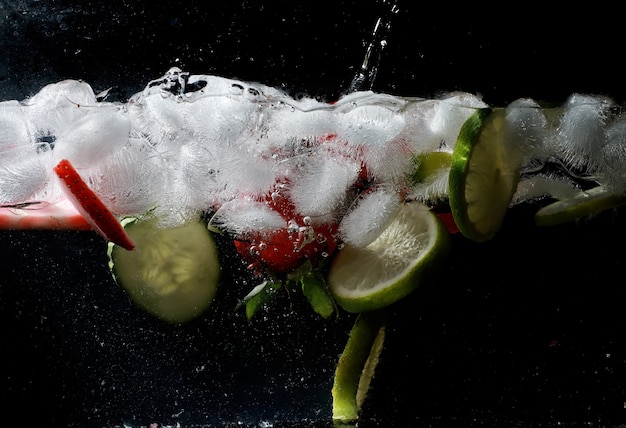 Water drops on ripe sweet fruits and berry. Fresh fruits background with copy space for your text. Vegan and vegetarian concept.