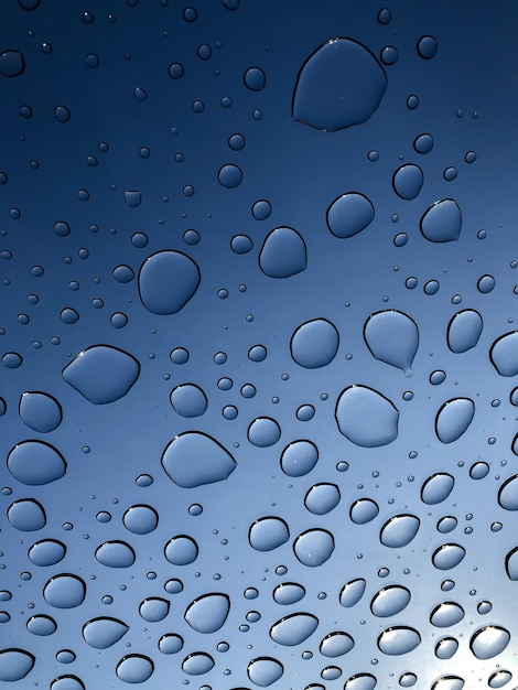 Water drops through the window after the rain