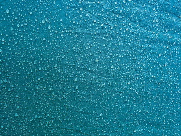 Water drops on waterproof membrane fabric. Morning dew on tent.