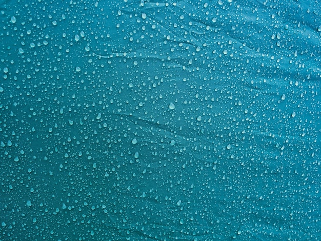 Water drops on waterproof membrane fabric. Morning dew on tent.