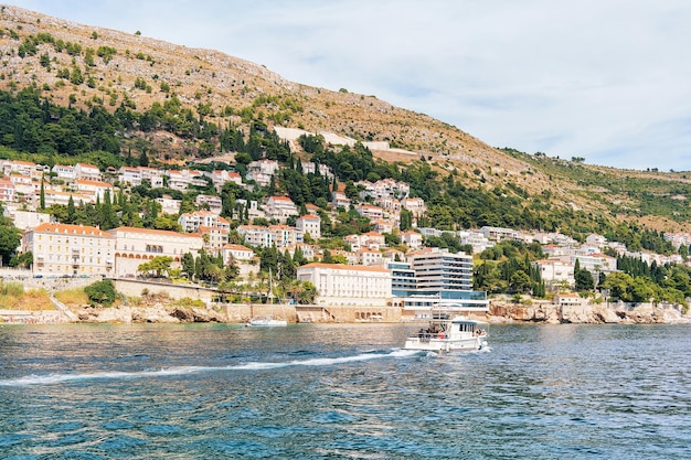 Water Ferry with people at Dubrovnik coast in the Adriatic Sea, Croatia