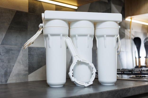 Water filtration system with replaceable cartridges A system in an apartment with three tanks for cleaning water from under the tap