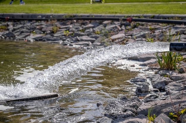 Water flowing from a metal pipe in a public park