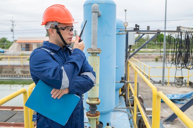 Water plant maintenance technicians mechanical engineers check the control system at the water treatment plant