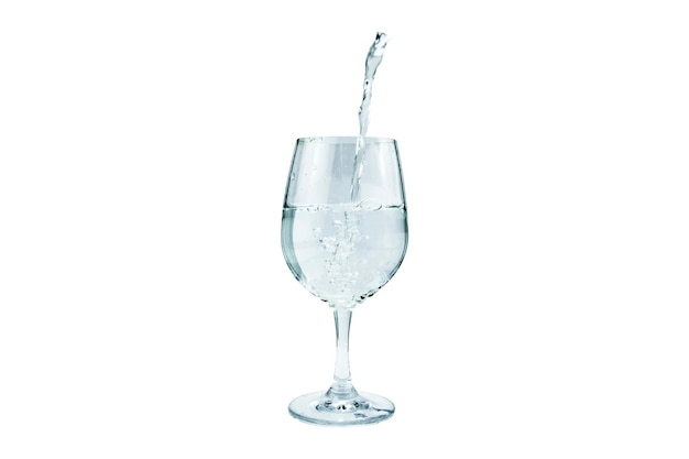 Water poured into a wine glass on an isolated background