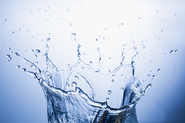 Water splash on blue abstract background