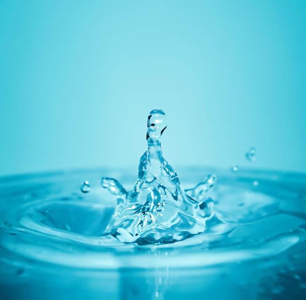 Water splash on blue background in macro