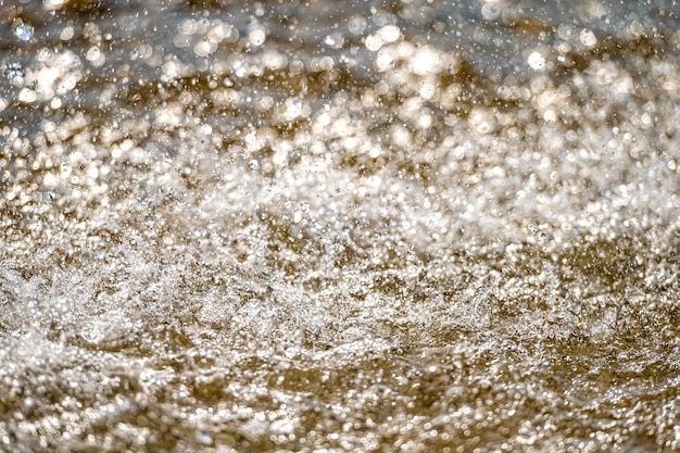 Water splash with small drops in the fountain Abstract natural selective focus copy space