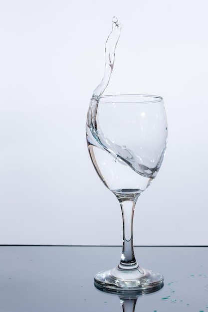 Water splashes in a glass on a white background