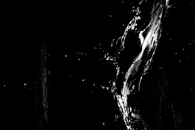 Water splashes isolated on black background white jets with drops