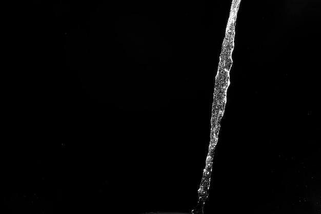 Water splashes isolated on black background white jets with drops