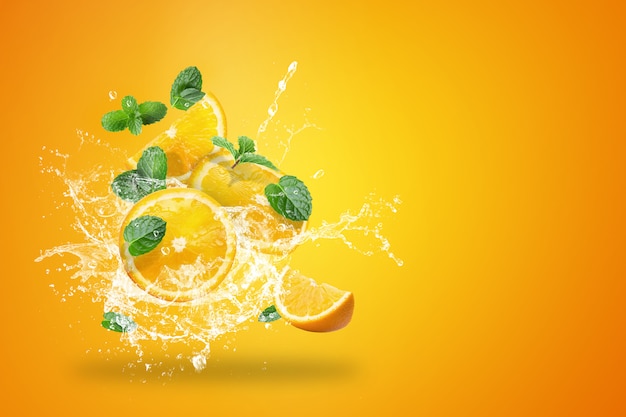 Water splashing on fresh sliced oranges fruit