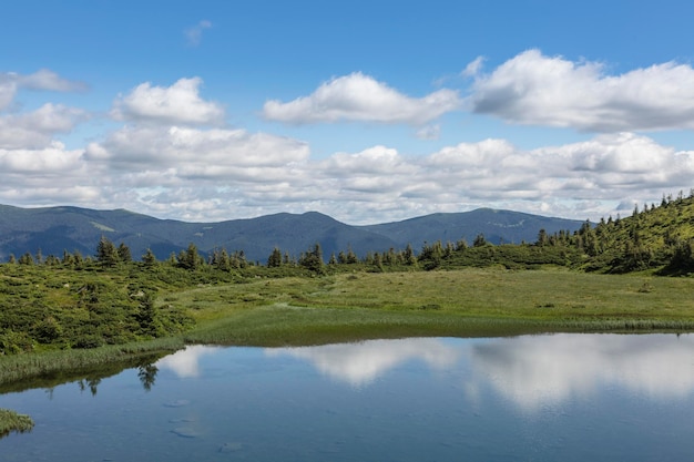 The water surface of a blue lake against the background of the Gorgan mountain range Carpathians