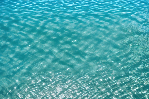 Water surface and sun reflection in swimming pool