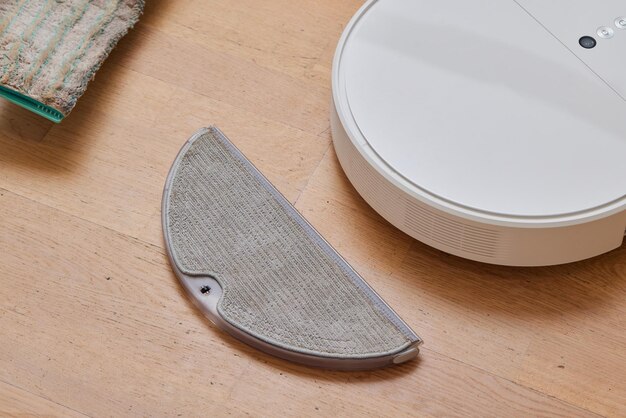 Water tank of a robot vacuum claner Mop feature with attachment