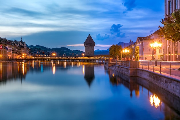 Water Tower, Wasserturm, and Chapel Bridge, Kapellbrucke over the river Reuss at night in Old Town of Lucerne, Switzerland