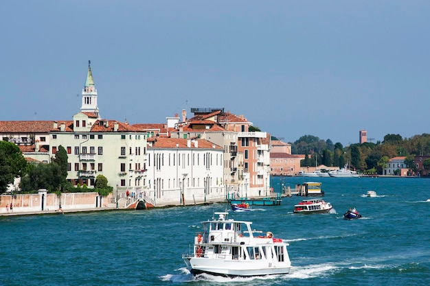 Water traffic of water-bus and civil boats in summer Venice