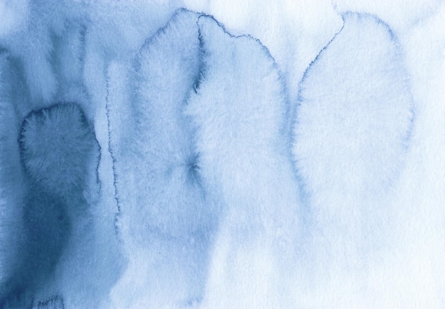 Watercolor dark blue and white ombre background texture. Royal blue gradient backdrop. Watercolour stains on paper, hand painted.