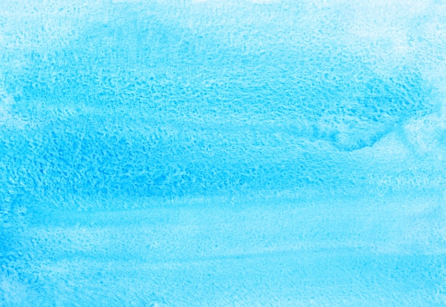 Watercolor light blue background painting. Water color bright sky blue stains on paper.	