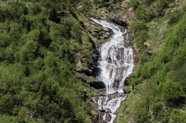 Waterfall in nature with mountains