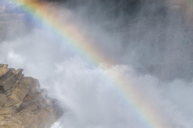 Waterfall with fog and rainbow