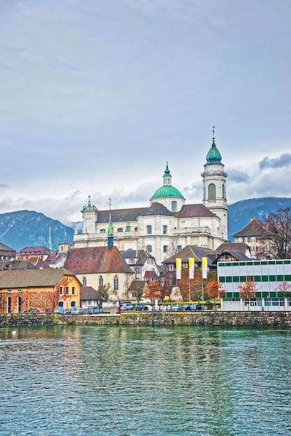 Waterfront and St Ursus Cathedral in Solothurn. Solothurn is the capital of Solothurn canton in Switzerland. It is located on the banks of Aare and on the foot of Weissenstein Jura mountains