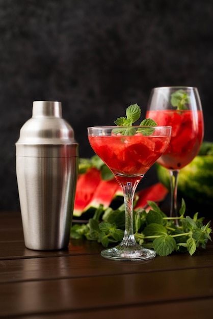 Watermelon alcoholik or non alcoholic cocktail with mint on dark background