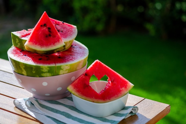 Watermelon berry Summer berry Watermelon backgroundJuicy red watermelon with carved heart Summer