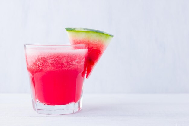 Watermelon drink in glasses with slices of watermelon Watermelon smoothies on white background