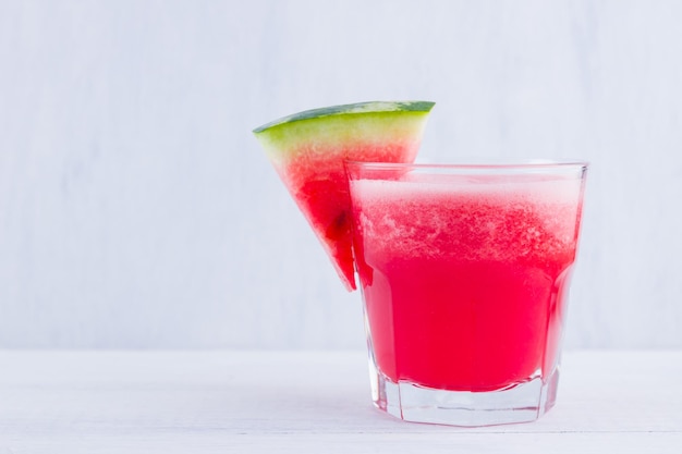 Watermelon drink in glasses with slices of watermelon Watermelon smoothies on white background