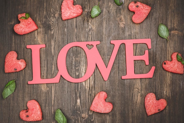 Watermelon hearts on wooden table