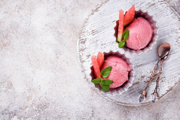 Watermelon ice cream in metal bowls 