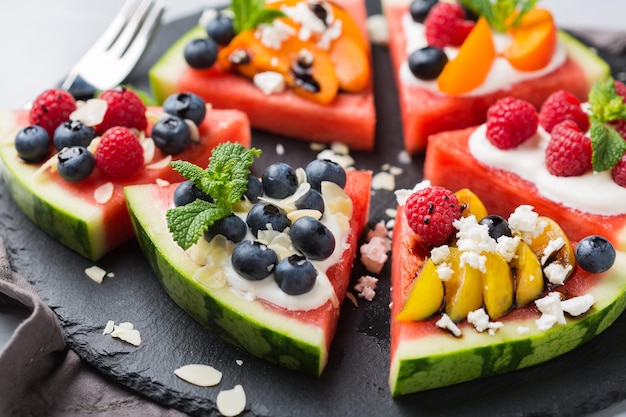 Watermelon pizza with berries fruit yogurt feta cheese