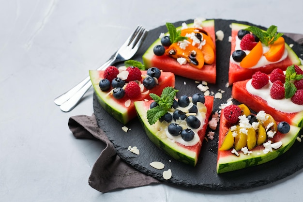 Watermelon pizza with berries fruit yogurt feta cheese