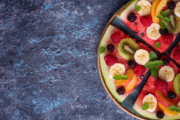 Watermelon pizza with fruit and berries