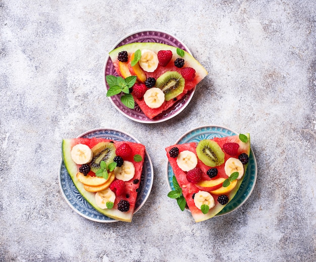 Watermelon pizza with fruit and berries