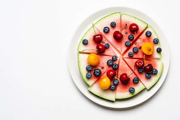 Watermelon pizza with fruits and berries