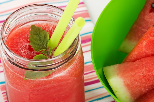 Watermelon red smoothie in a jar with fresh mint