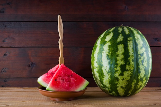 Watermelon on wooden boards Whole watermelon on wooden background Healthy food for vegan Copy space