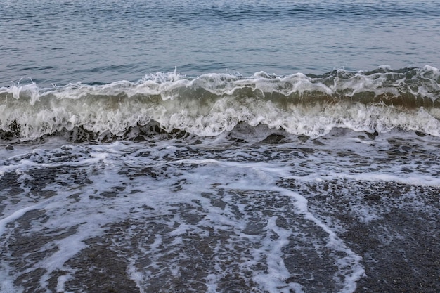 A wave coming ashore in the early morning