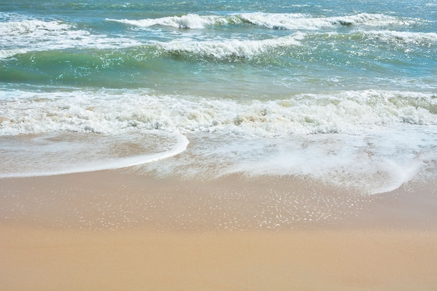 Wave of the sea on the sand beach,  Beach and tropical sea, Paradise idyllic beach.