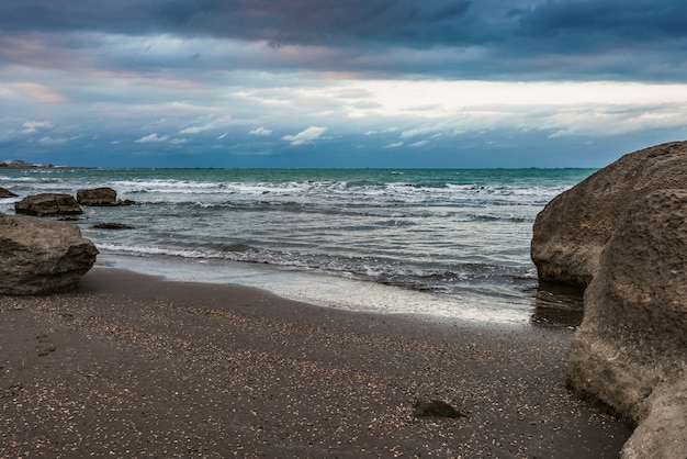 Wave splashing at the rocks freshness on beach