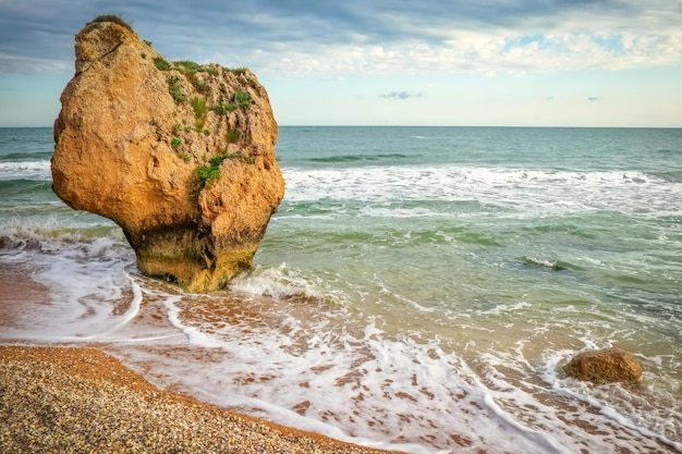 Waves beat against the coastal sea rock Rocks beach and beautiful turquoise sea water Exotic beach Beautiful landscape Composition of nature General's Beaches Crimea