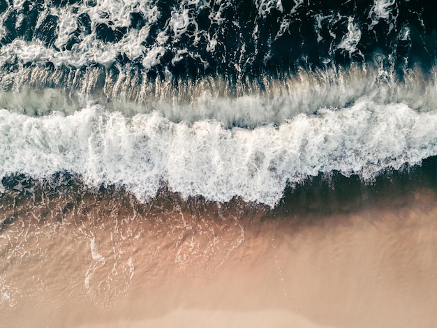 Waves on the sea coast Beach with white sand and the blue sea