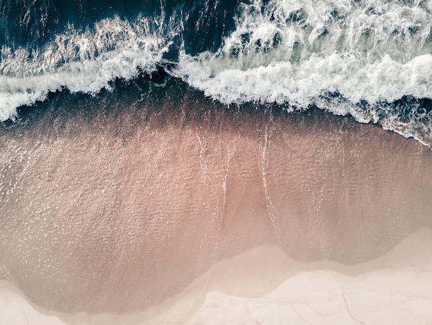 Waves on the sea coast Beach with white sand and the blue sea