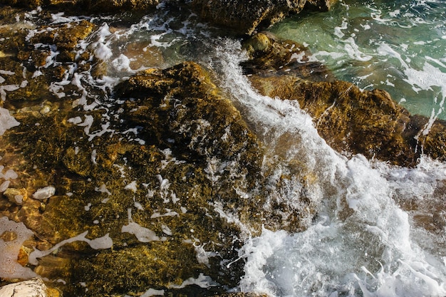 The waves of the sea on the stony beach of Kefalonia