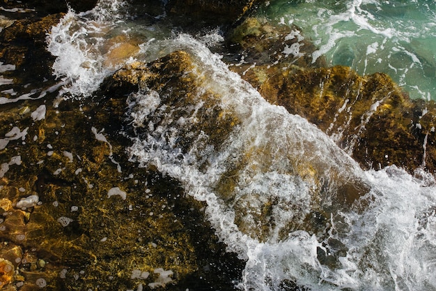 The waves of the sea on the stony beach of Kefalonia